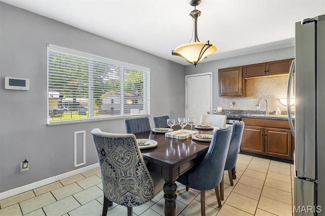 1326 Petite Dr, Saint Louis, MO 63138 - dining area featuring light tile patterned floors and baseboards