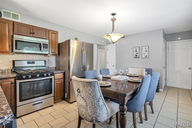1326 Petite Dr, Saint Louis, MO 63138 - dining space featuring light tile patterned floors