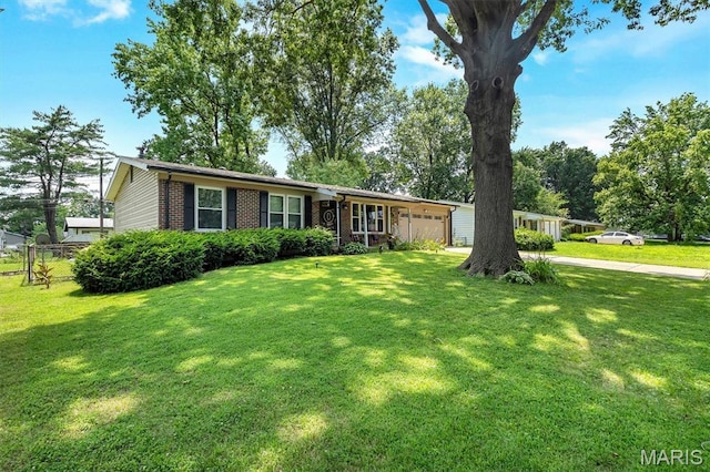 1326 Petite Dr, Saint Louis, MO 63138 - ranch-style house with an attached garage, brick siding, a front lawn, and concrete driveway