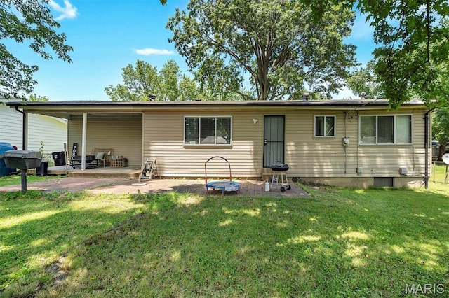 1326 Petite Dr, Saint Louis, MO 63138 - back of house with a patio and a yard