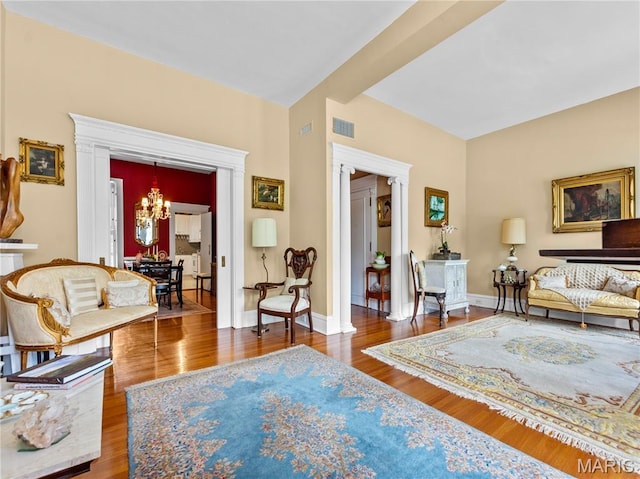 10 N Kingshighway Blvd Unit 4C, Saint Louis, MO 63108 - living room featuring a chandelier and wood finished floors