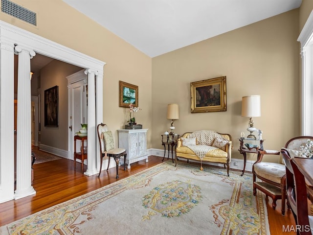 10 N Kingshighway Blvd Unit 4C, Saint Louis, MO 63108 - living area with ornate columns and wood finished floors