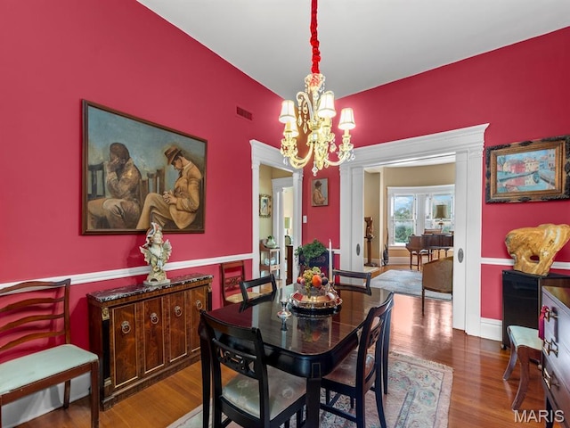 10 N Kingshighway Blvd Unit 4C, Saint Louis, MO 63108 - dining area with wood finished floors and a chandelier