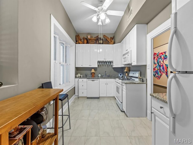 10 N Kingshighway Blvd Unit 4C, Saint Louis, MO 63108 - kitchen with white appliances, light marble finish floors, ceiling fan, and white cabinetry