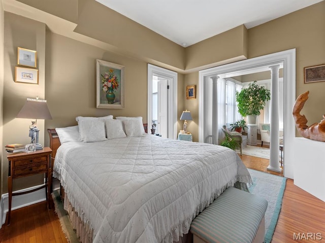 10 N Kingshighway Blvd Unit 4C, Saint Louis, MO 63108 - bedroom with access to exterior and wood finished floors