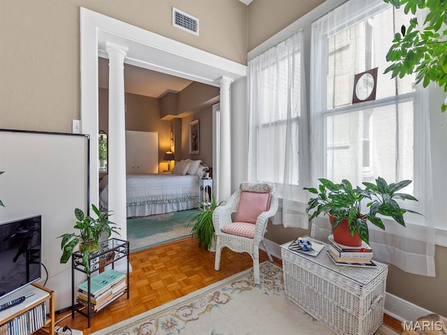 10 N Kingshighway Blvd Unit 4C, Saint Louis, MO 63108 - living area featuring decorative columns and plenty of natural light