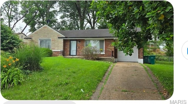 9239 Astoria Dr, Saint Louis, MO 63137 - ranch-style house with brick siding, a front lawn, and driveway
