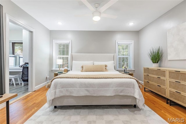 7801 Delmar Blvd Unit 2W, University City, MO 63130 - bedroom featuring multiple windows, wood finished floors, and a ceiling fan