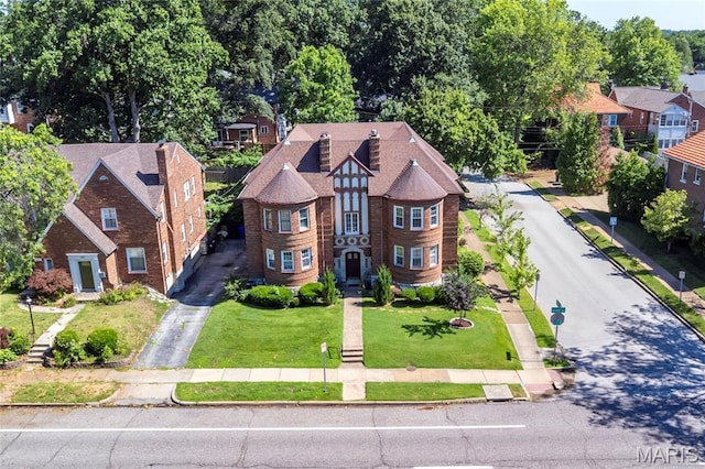 7801 Delmar Blvd Unit 2W, University City, MO 63130 - view of front facade with driveway and a front yard
