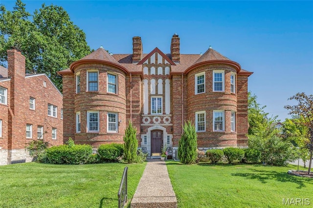 7801 Delmar Blvd Unit 2W, University City, MO 63130 - view of front of home with a front lawn and brick siding