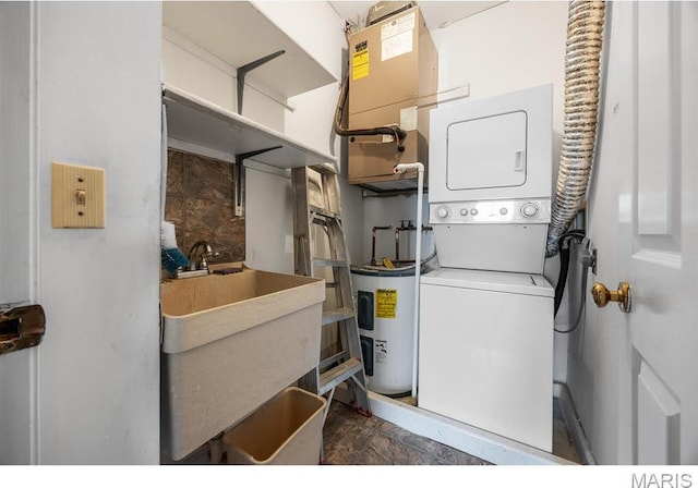 10 Jefferson Rd Unit 3A, Webster Groves, MO 63119 - laundry area with electric water heater and stacked washer and clothes dryer