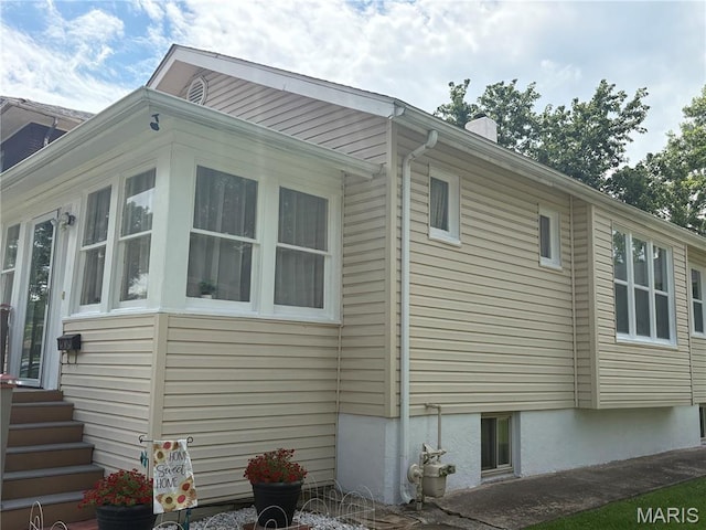 2425 State St, Granite City, IL 62040 - view of property exterior featuring a chimney