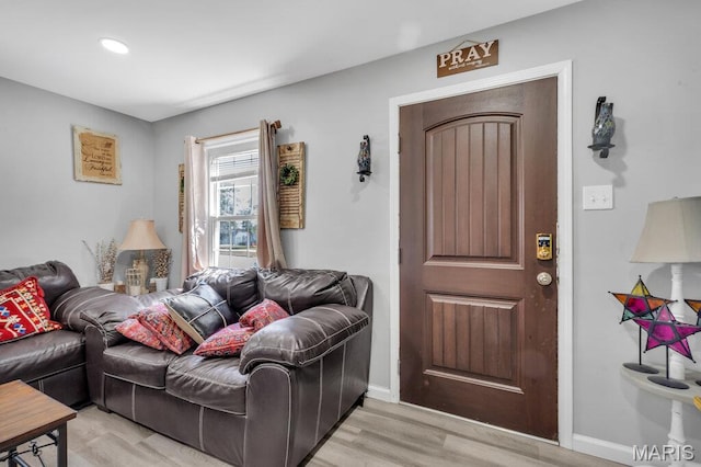 3711 Ashby Rd, Saint Ann, MO 63074 - living area featuring light wood-type flooring and baseboards