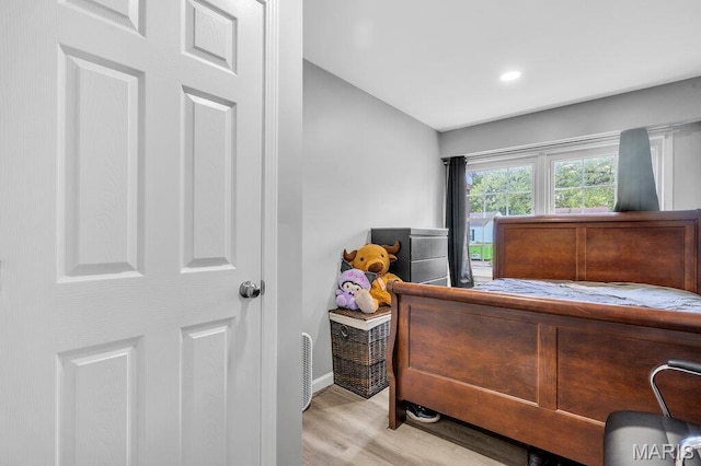 3711 Ashby Rd, Saint Ann, MO 63074 - bedroom with light wood-type flooring and lofted ceiling