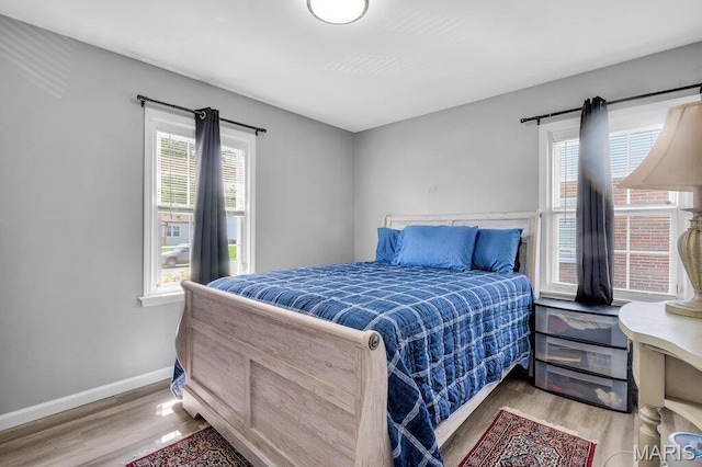3711 Ashby Rd, Saint Ann, MO 63074 - bedroom featuring wood finished floors and baseboards