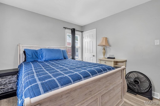 3711 Ashby Rd, Saint Ann, MO 63074 - bedroom featuring wood finished floors and baseboards