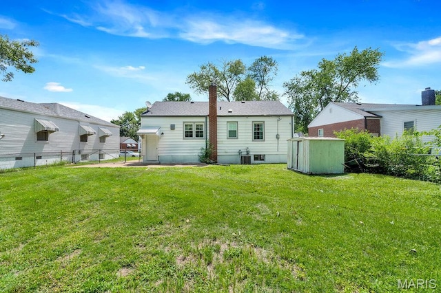 3711 Ashby Rd, Saint Ann, MO 63074 - rear view of house featuring a shed and a chimney