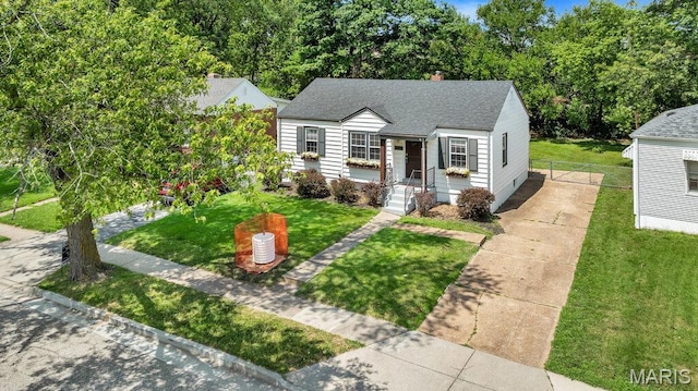 3711 Ashby Rd, Saint Ann, MO 63074 - view of front facade featuring a shingled roof and a chimney