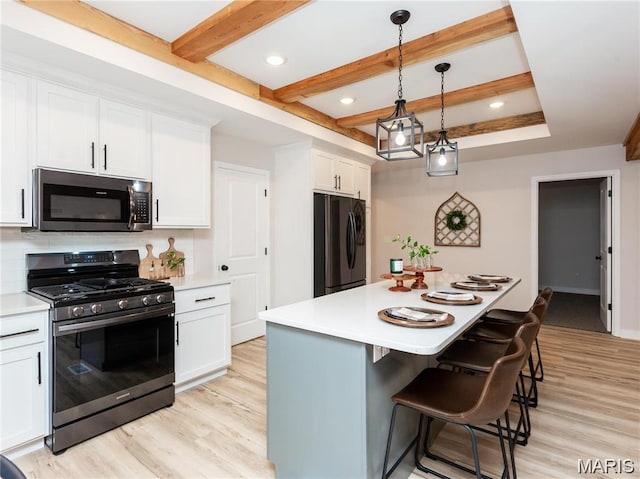 24925 State Route Mm, Farmington, MO 63640 - kitchen featuring appliances with stainless steel finishes, light wood-style floors, light countertops, beamed ceiling, and recessed lighting