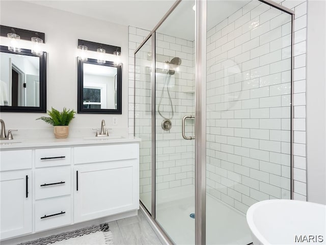 24925 State Route Mm, Farmington, MO 63640 - full bathroom with a shower stall, double vanity, a freestanding bath, and marble look tile flooring