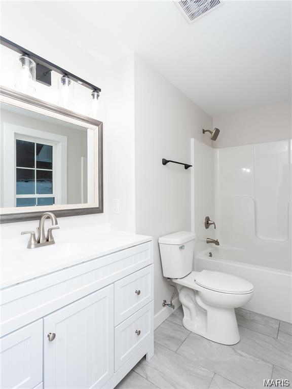 24925 State Route Mm, Farmington, MO 63640 - bathroom featuring vanity and shower / tub combination