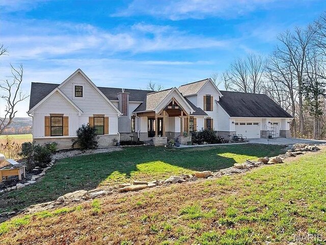24925 State Route Mm, Farmington, MO 63640 - view of front of property featuring a chimney, a front yard, and a garage