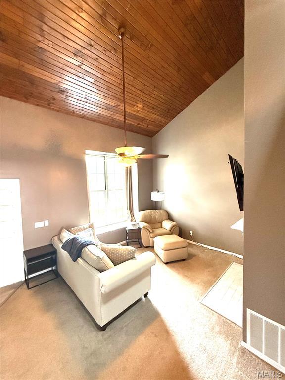 1729 Honeysuckle Dr, Saint Charles, MO 63303 - carpeted living room featuring wood ceiling, lofted ceiling, and a ceiling fan