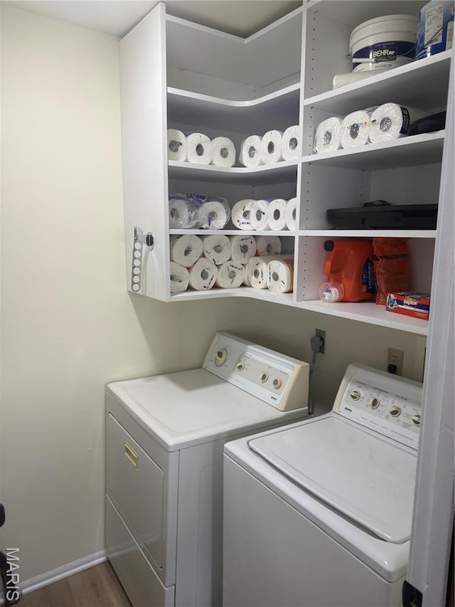 1729 Honeysuckle Dr, Saint Charles, MO 63303 - laundry area featuring washer and dryer and wood finished floors