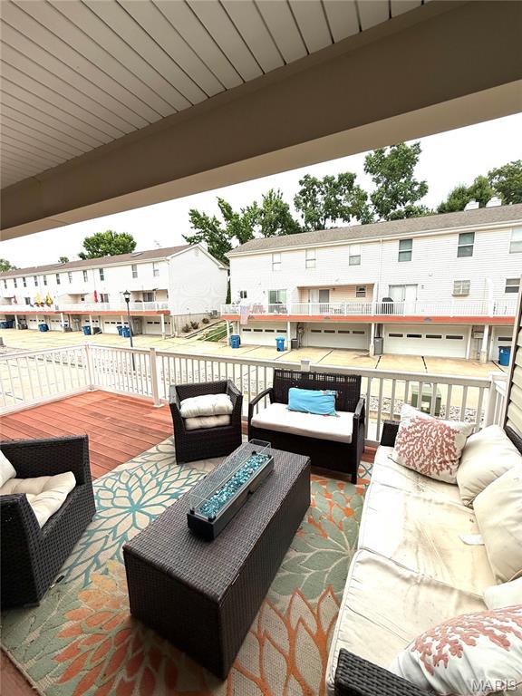 1729 Honeysuckle Dr, Saint Charles, MO 63303 - view of patio featuring an outdoor hangout area, a wooden deck, and a residential view