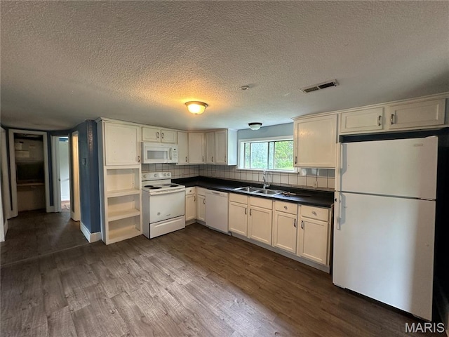 1506 S Gertrude St, Salem, MO 65560 - kitchen featuring white appliances, dark wood-style flooring, a textured ceiling, dark countertops, and decorative backsplash