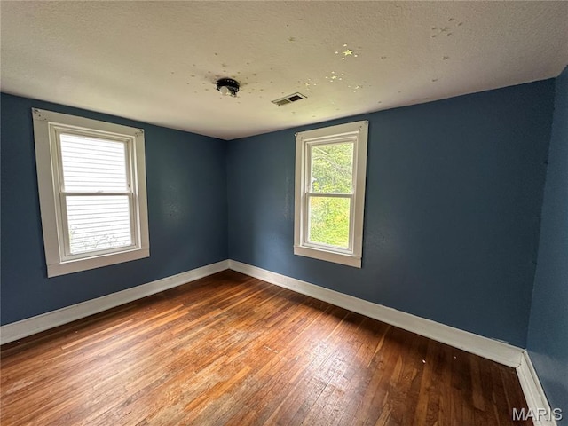 1506 S Gertrude St, Salem, MO 65560 - unfurnished room featuring wood-type flooring and baseboards