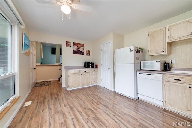 1340 Central Pkwy, Florissant, MO 63031 - kitchen with white appliances, light wood-style floors, ceiling fan, and light countertops
