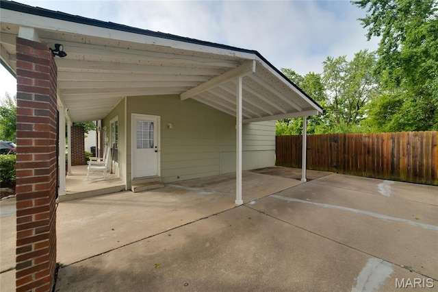 1340 Central Pkwy, Florissant, MO 63031 - view of patio featuring a carport