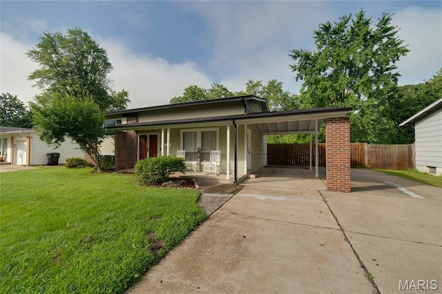 1340 Central Pkwy, Florissant, MO 63031 - view of front of home featuring concrete driveway, a carport, and covered porch