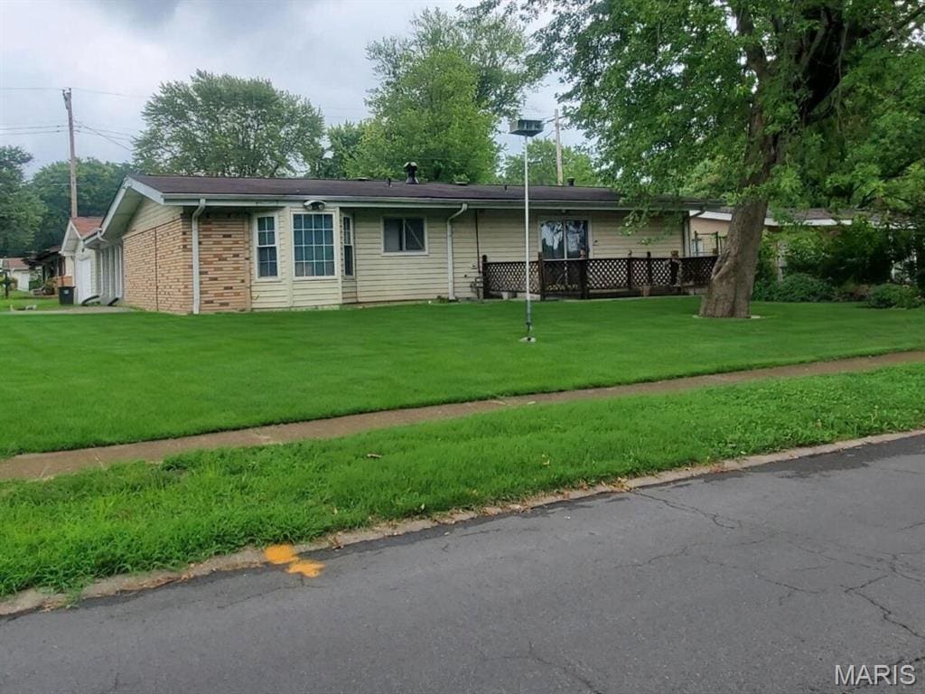 2240 Brook Dr, Florissant, MO 63033 - view of front of home with a front lawn and brick siding