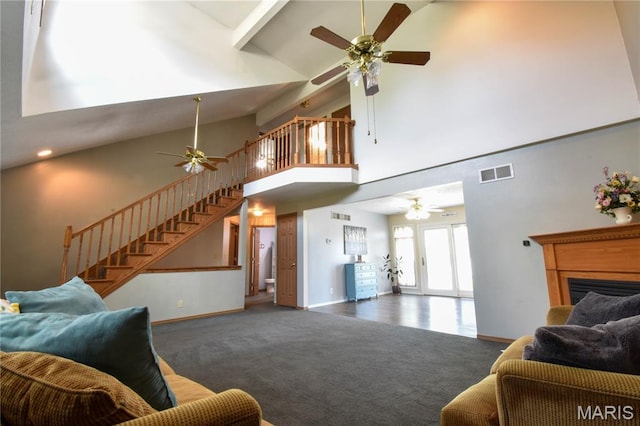 408 Marty Graten Ct, Hamel, IL 62046 - living room featuring ceiling fan, stairs, high vaulted ceiling, a fireplace, and carpet flooring