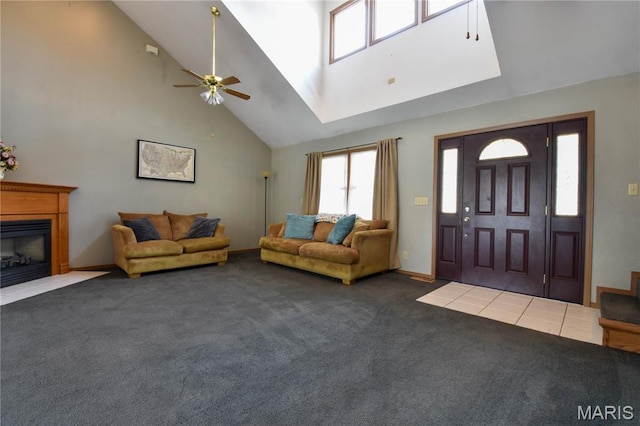 408 Marty Graten Ct, Hamel, IL 62046 - foyer featuring high vaulted ceiling, ceiling fan, carpet floors, and a glass covered fireplace
