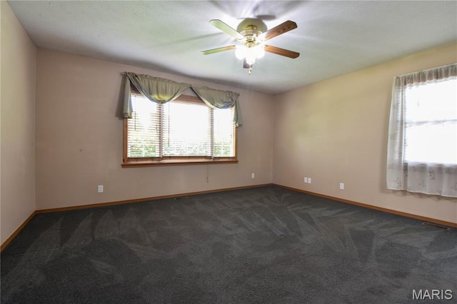 408 Marty Graten Ct, Hamel, IL 62046 - unfurnished room featuring healthy amount of natural light, dark carpet, and ceiling fan