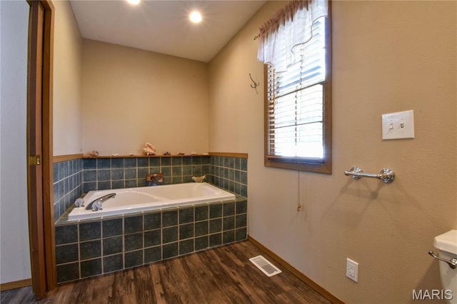408 Marty Graten Ct, Hamel, IL 62046 - bathroom featuring wood finished floors and a garden tub