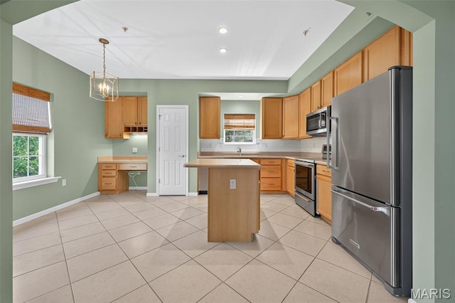 5 Monarch Trace Ct Unit 305, Chesterfield, MO 63017 - kitchen with stainless steel appliances, light countertops, light tile patterned flooring, healthy amount of natural light, and recessed lighting