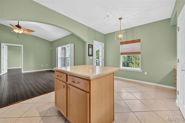 5 Monarch Trace Ct Unit 305, Chesterfield, MO 63017 - kitchen featuring arched walkways, lofted ceiling, plenty of natural light, hanging light fixtures, and a kitchen island