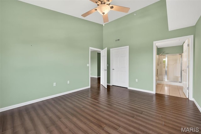 5 Monarch Trace Ct Unit 305, Chesterfield, MO 63017 - unfurnished bedroom with wood finished floors, a towering ceiling, ceiling fan, and ensuite bath
