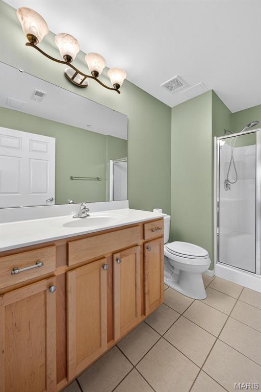 5 Monarch Trace Ct Unit 305, Chesterfield, MO 63017 - bathroom with tile patterned flooring, vanity, and a shower stall