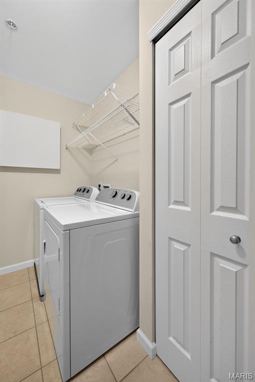 5 Monarch Trace Ct Unit 305, Chesterfield, MO 63017 - laundry room with separate washer and dryer and light tile patterned flooring