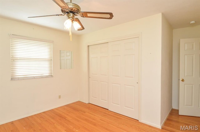 318 W Oak St, Mascoutah, IL 62258 - unfurnished bedroom featuring light wood finished floors, a closet, and ceiling fan