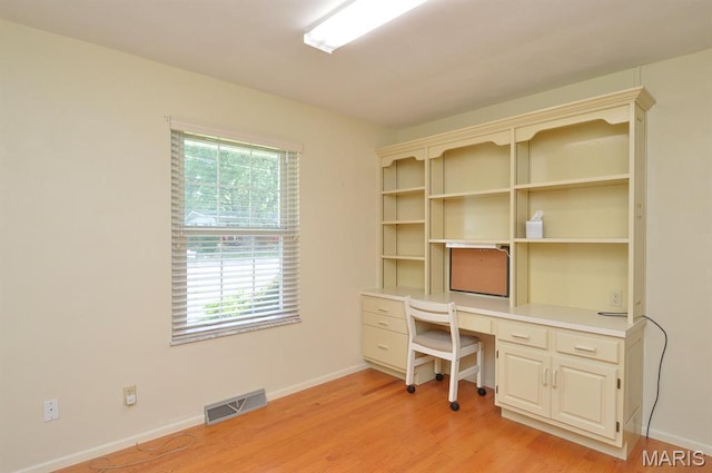 318 W Oak St, Mascoutah, IL 62258 - unfurnished office featuring light wood-style flooring and built in desk