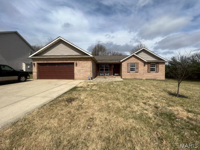 2763 Cascade Lake Dr, Belleville, IL 62221 - ranch-style home featuring brick siding, an attached garage, concrete driveway, and a front yard