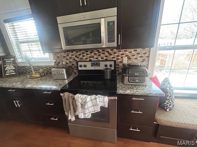 2763 Cascade Lake Dr, Belleville, IL 62221 - kitchen with appliances with stainless steel finishes, decorative backsplash, and light stone countertops
