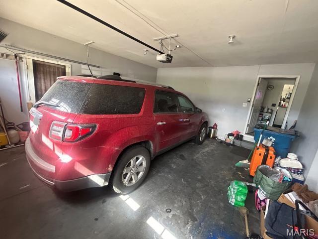 2763 Cascade Lake Dr, Belleville, IL 62221 - garage featuring a garage door opener
