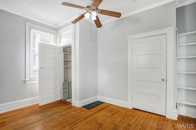 2617 Sutton Blvd, Maplewood, MO 63143 - unfurnished bedroom featuring hardwood / wood-style floors, ornamental molding, and a ceiling fan
